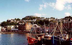 the town of oban with mccaigs folly in the background